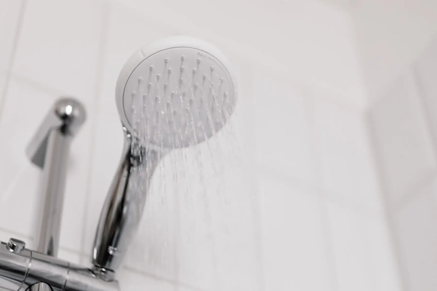 A shower rose running water