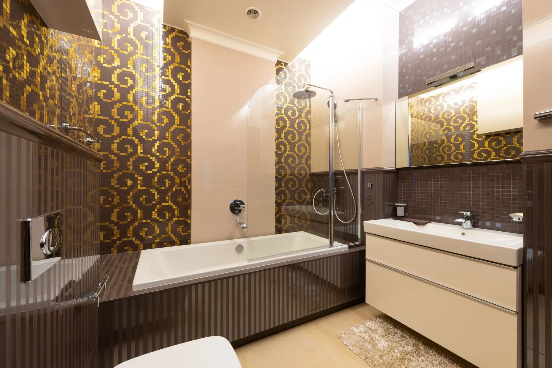 A tiled bathroom with a patterned feature wall